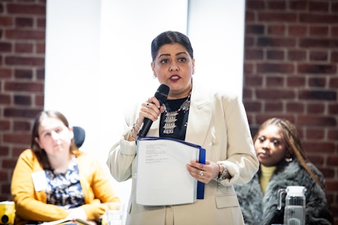 Image shows Neelofer Nova a poet, writer and spoken word artist performing at the Certitude and MTVH International Women's Day Event 2024