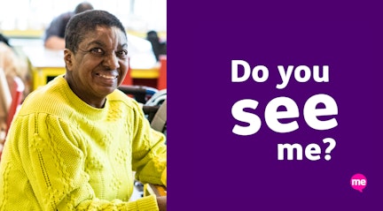 Image shows a picture of faye smiling wearing a yellow jumper next to purple campaign graphic representing learning disability week with the words 'Now you see me' written in white text and the Mencap logo