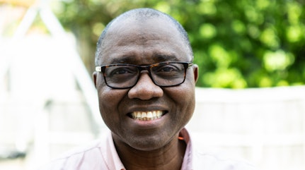 Image shows Olaide smiling