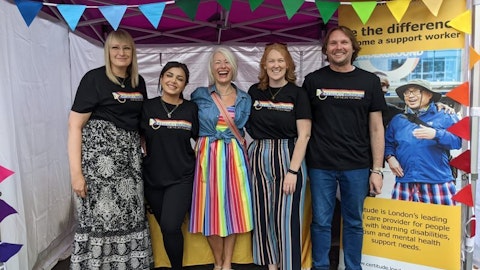 images shows certitude colleagues smiling in front of our Pride London stand