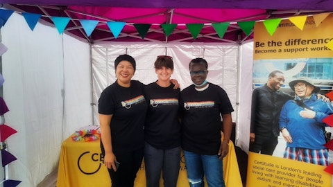 images shows certitude colleagues smiling in front of our Pride London stand